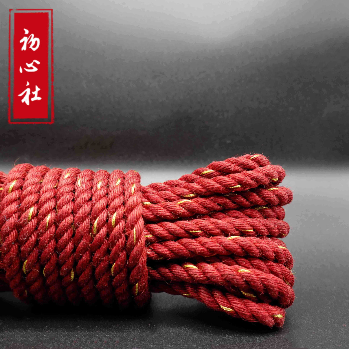 Multi colored jute rope kit, featuring vibrant, tightly braided jute strands in a rich red hue.